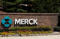 FILE PHOTO: The Merck logo is seen at a gate to the Merck & Co campus in Linden, New Jersey, U.S., July 12, 2018. REUTERS/Brendan McDermid/File Photo