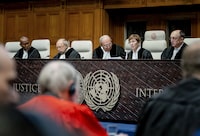 President of the International Court of Justice (ICJ) US lawyer Joan Donoghue (2R) confers with colleagues at the court in The Hague on January 12, 2024, prior to the hearing of the genocide case against Israel, brought by South Africa. Israel said that it was not seeking to destroy the Palestinian people, as it hit back at what it called a "profoundly distorted" and "malevolent" genocide case against it at the UN's top court.  South Africa has launched an emergency case at the International Court of Justice (ICJ) arguing that Israel stands in breach of the UN Genocide Convention, signed in 1948 in the wake of the Holocaust. (Photo by Remko de Waal / ANP / AFP) / Netherlands OUT (Photo by REMKO DE WAAL/ANP/AFP via Getty Images)