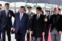 France's Prime Minister Gabriel Attal (2nd R) greets China's President Xi Jinping upon their arrival for an official two-day state visit, at Orly airport, south of Paris on May 5, 2024. Chinese President Xi Jinping arrived in France on May 5, 2024, for a state visit hosted by Emmanuel Macron where the French leader will seek to push his counterpart on issues ranging from Ukraine to trade. (Photo by STEPHANE DE SAKUTIN / POOL / AFP) (Photo by STEPHANE DE SAKUTIN/POOL/AFP via Getty Images)