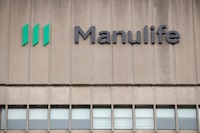 Signage is seen on Manulife Financial Corp.'s office tower in Toronto, Tuesday, Feb. 11, 2020. Manulife Financial Corp. says patients who require specialty drugs will be able to fill their prescriptions at any pharmacy following backlash sparked by the insurance provider signing an exclusive arrangement with Loblaw Cos. Ltd. THE CANADIAN PRESS/Cole Burston