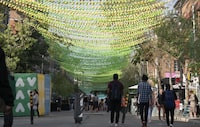 <p>The art installation know as "18 Shades of Gay," is seen above Ste-Catherine street in Montreal's Gay Village in Montreal on Tuesday, September 3, 2019. Members of the community in Montreal's Village neighbourhood say they've seen improvements to local security and cleanliness, but that Quebec needs to do more to support vulnerable people in the area. THE CANADIAN PRESS/Paul Chiasson</p>