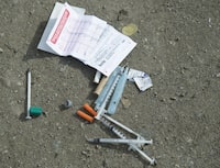 Needles are seen on the ground in Oppenheimer park in Vancouver's downtown eastside on March 17, 2020. The scourge of overdose deaths underscores the need for Canada to decriminalize simple possession of hard drugs, the head of the national chiefs of police association said on Thursday. In urging action, Bryan Larkin noted that overdose deaths are outpacing those from the pandemic and homicides in British Columbia and likely Ontario. THE CANADIAN PRESS/Jonathan Hayward