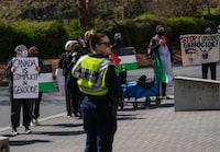 Saanich Police say an assault investigation is underway following two alleged incidents at the protest encampment on the grounds of the University of Victoria. Pro-Palestinian protesters hold a demonstration during a visit by Prime Minister Justin Trudeau to the University of Victoria, in Saanich, B.C., on Friday, April 19, 2024. THE CANADIAN PRESS/Darryl Dyck