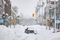 A truck is abandoned on a snow-covered street after a winter storm in Sydney, N.S. on Monday, Feb.5, 2024. A local state of emergency remained in effect in parts of Cape Breton on Monday, as Nova Scotia dug out from one of the heaviest snowfalls in 20 years.THE CANADIAN PRESS/Shane Wilkie