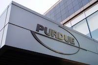 FILE - This Tuesday, May 8, 2007, file photo shows the logo for pharmaceutical giant Purdue Pharma at its offices in Stamford, Conn. A federal judge on Thursday, Dec. 16, 2021, has rejected OxyContin maker Purdue Pharma’s bankruptcy settlement of thousands of lawsuits over the opioid epidemic because of a provision that would protect members of the Sackler family from facing litigation of their own. (AP Photo/Douglas Healey, File)