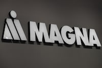 FILE PHOTO: Magna logo is during Munich Auto Show, IAA Mobility 2021 in Munich, Germany, September 8, 2021. REUTERS/Wolfgang Rattay/File Photo