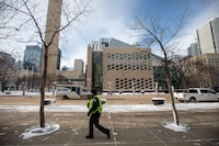 Edmonton's public library has announced plans to close in advance of a looming strike deadline by thousands of city workers. A sheriff patrols City Hall in Edmonton, Tuesday, Jan. 23, 2024. THE CANADIAN PRESS/Jason Franson
