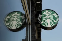 FILE PHOTO: A Starbucks logo hangs outside a store in the Brooklyn borough of New York, U.S., May 29, 2018.  REUTERS/Lucas Jackson/File Photo