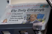 FILE PHOTO: FILE PHOTO: Copies of The Daily Telegraph are displayed on a rack in a supermarket in London, Britain, January 20, 2024. REUTERS/Belinda Jiao/File Photo