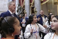 Former Speaker of the House Rep. Kevin McCarthy, R-Calif., talks with visitors after leaving the House chamber on Capitol Hill, Friday, Oct. 20, 2023, in Washington. (AP Photo/Mariam Zuhaib)