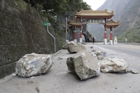Taiwan's Central News Agency says a Canadian missing after this week's powerful earthquake on the island's east coast has been found safe, citing information from the Central Emergency Operation Center. Rocks are on the road at the entrance of Taroko National Park in Hualien County, eastern Taiwan, Thursday, April 4, 2024. THE CANADIAN PRESS/Chiang Ying-ying