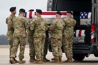 An Army carry team loads the transfer case containing the remains of U.S. Army Sgt. Kennedy Ladon Sanders, 24, of Waycross, Ga., to a vehicle along with the remains of Sgt. William Jerome Rivers, 46, of Carrollton, Ga., and Sgt. Breonna Alexsondria Moffett, 23, of Savannah, Ga., at Dover Air Force Base, Del., Friday, Feb. 2, 2024. The three were killed in a drone attack in Jordan on Jan. 28. (AP Photo/Matt Rourke)