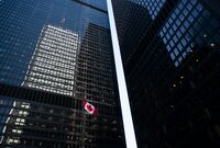The Canadian flag flutters in the wind at the TD Centre in Toronto’s Financial District, on Mar 15, 2023.