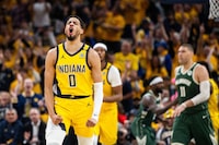 Apr 26, 2024; Indianapolis, Indiana, USA; Indiana Pacers guard Tyrese Haliburton (0) reacts to a made basket during game three of the first round for the 2024 NBA playoffs against the Milwaukee Bucks at Gainbridge Fieldhouse. Mandatory Credit: Trevor Ruszkowski-USA TODAY Sports