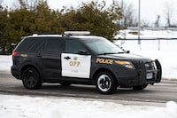 An Ontario Provincial Police (OPP) cruiser leaves Beckwith Park during an alert, warning armed suspects at large, in Beckwith, Ont., Friday, Feb. 10, 2023. The OPP say two armed suspects are at large in the Lanark County and Sharbot Lake areas, in an incident that has prompted an emergency alert. THE CANADIAN PRESS/Spencer Colby