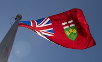 A total of 13 men have been arrested and charged after a human trafficking investigation in Niagara Falls, Ont. Ontario's provincial flag flies in Ottawa, Monday, July 6, 2020. THE CANADIAN PRESS/Adrian Wyld