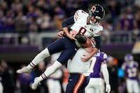 Chicago Bears place-kicker Cairo Santos (8) celebrates with teammate guard Lucas Patrick after kicking a 30-yard field goal during the second half of an NFL football game against the Minnesota Vikings, Monday, Nov. 27, 2023, in Minneapolis. The Bears won 12-10. (AP Photo/Abbie Parr)