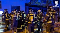 Firefighters gather outside a restaurant following a fire, in Madrid, Spain, April 21, 2023, in this screen grab taken from a handout video. Madrid Emergency Service/Handout via REUTERS