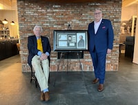 Donald Sutherland and Canada Post President and CEO Doug Ettinger pose with a framed stamp enlargement in a handout photo. THE CANADIAN PRESS/HO-Rossif Sutherland **MANDATORY CREDIT** 