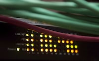 Lights on an internet switch are lit up as with users in an office in Ottawa, on February 10, 2011.&nbsp;Constellation Software Inc. says it has signed a deal to buy Black Knight Inc.'s Optimal Blue business for US$700 million. THE CANADIAN PRESS/Adrian Wyld
