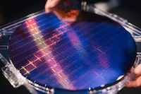 A wafer of Intel’s new Sapphire Rapids microprocessors, at the chipmaker’s headquarters in Santa Clara, Calif. on Jan. 9, 2023. Sapphire Rapids’ lengthy development has underscored some of the challenges facing Intel at a moment when the United States is trying to assert its dominance in the foundational computer technology. (Anastasiia Sapon/The New York Times)