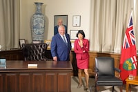Ontario Premier Doug Ford and Toronto Mayor Olivia Chow take their seats after looking at family photos in the Premier's office as they hold a meeting at the Queens Park Legislature in Toronto on Monday, Sept. 18,2023.THE CANADIAN PRESS/Chris Young