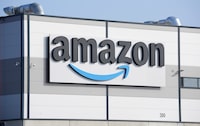 FILE - An Amazon company logo is seen on the facade of a company's building in Schoenefeld near Berlin, Germany, on March 18, 2022. Multinational companies including Amazon, Marriott and Hilton pledged Monday June 19, 2023 to hire more than 13,000 refugees, including Ukrainian women who have fled the war with Russia, over the next three years in Europe. (AP Photo/Michael Sohn, File)