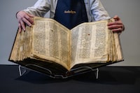 The 'Codex Sassoon' bible is displayed at Sotheby's in New York on February 15, 2023. - According to Sotheby's the Codex Sassoon is the earliest and most complete Hebrew Bible ever discovered and will be offered for auction with an estimate of 30-50 million US dollars, making it the most valuable printed text or historical document ever offered. (Photo by Ed JONES / AFP) (Photo by ED JONES/AFP via Getty Images)
