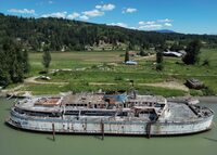 The retired BC Ferries vessel Queen of Sidney, that was in operation from 1960 to 2000, is seen moored on the Fraser River, in Mission, B.C., on Tuesday, July 18, 2023. The Canadian government's inventory of more than 1,700 wrecked, abandoned or hazardous boats includes a U.S. warship, a derelict floating McDonald's known as the McBarge, a human-smuggling ship and an old BC Ferries vessel rotting on the Fraser River. THE CANADIAN PRESS/Darryl Dyck