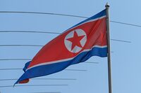 (FILES) The North Korean flag is seen in the country's embassy compounds in Kuala Lumpur on March 19, 2021, after North Korea severed diplomatic ties with Malaysia in response to the extradition of a citizen to the US earlier this month. From Angola to Hong Kong, North Korea is rapidly shuttering its overseas embassies, as Pyongyang's economy sputters and Kim Jong Un embraces 'new Cold War' diplomacy with Russia, experts say. (Photo by Sazali Ahmad / AFP) (Photo by SAZALI AHMAD/AFP via Getty Images)