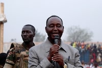 (FILES) Former President François Bozizé (R), leader of the Central African opposition party speaks during a rally in Bangui, Central African Republic, on November 24 2020. A UN-backed court announced on April 30, 2024 it has issued an arrest warrant for Central African Republic's former president Francois Bozize over possible crimes against humanity committed by imprisoned soldiers between 2009 and 2013.
Bozize who seized power in the Central African Republic in 2003 in a coup before being overthrown 10 years later by rebels and now heads the country's main rebellion, has been in exile in Guinea-Bissau since March 2023. (Photo by Camille LAFFONT / AFP) (Photo by CAMILLE LAFFONT/AFP via Getty Images)