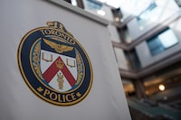 A logo at the Toronto Police Services headquarters, in Toronto, on Friday, August 9, 2019. A custodian has been arrested following an alleged sexual assault at a Toronto school earlier this year. THE CANADIAN PRESS/Christopher Katsarov