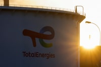 FILE PHOTO: A view of the TotalEnergies logo as the sun rises, on the day French riot police pushed back energy workers on strike as they gathered in front of the refinery to protest against the French government's pensions reform, in Gonfreville-L’Orcher near Le Havre, France, March 24, 2023. REUTERS/Pascal Rossignol