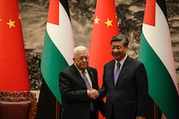 China's President Xi Jinping, right, and Palestinian President Mahmoud Abbas shake hands after a signing ceremony at the Great Hall of the People in Beijing Wednesday, June 14, 2023. (Jade Gao/Pool Photo via AP)