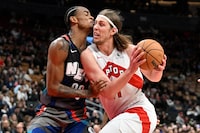 Mar 25, 2024; Toronto, Ontario, CAN;  Toronto Raptors forward Kelly Olynyk (41) drives to the basket past Brooklyn Nets center Nic Claxton (33) in the second half at Scotiabank Arena. Mandatory Credit: Dan Hamilton-USA TODAY Sports