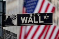 T Wall Street sign is pictured at the New York Stock Exchange (NYSE) in March of 2020.