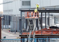 Workers assemble a new building at the Darlington nuclear facility in Courtice, Ont. on Thursday, October 30, 2014. 
Ontario Power Generation and the province are planning three more small modular reactors at the site of the Darlington nuclear power plant. THE CANADIAN PRESS/Frank Gunn
