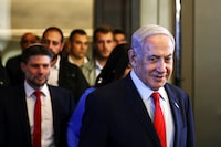 Israeli Prime Minister Benjamin Netanyahu and Finance Minister Bezalel Smotrich arrive at a press conference in Jerusalem on July 30.