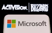 FILE PHOTO: Microsoft logo is seen on a smartphone placed on displayed Activision Blizzard logo in this illustration taken January 18, 2022. REUTERS/Dado Ruvic/Illustration/File Photo