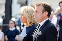 France's President Emmanuel Macron (R) and his wife Brigitte Macron pay their respects by the coffins of former French politician and Holocaust survivor Simone Veil and her husband Antoine Veil during the burial ceremony at the Pantheon in Paris on July 1, 2018.
Former Health Minister, Simone Veil, who passed away on June 30, 2017 became president of the European Parliament and one of France's most revered politicians by advocating the 1975 law legalising abortion in France. She will be only the fifth woman buried at the monument to France's dignitaries, where she will be laid to rest at the Pantheon with her husband Antoine, a high-ranking civil servant who died in 2013. / AFP PHOTO / POOL / LUDOVIC MARINLUDOVIC MARIN/AFP/Getty Images