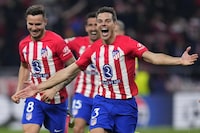 Atletico Madrid players, Cesar Azpilicueta, right, Saul, left, and Stefan Savic celebrate winning the Champions League, round of 16, second leg soccer match against Inter Milan at the Metropolitano stadium in Madrid, Spain, Wednesday, March 13, 2024. Atletico Madrid won 3-2 in a penalty shootout. (AP Photo/Manu Fernandez)