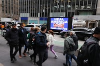 NEW YORK, NEW YORK - FEBRUARY 21: People pass by a video truck as members of Rise and Resist participate in their weekly "Truth Tuesday" protest at News Corp headquarters on February 21, 2023 in New York City. Text messages and emails between various Fox News hosts and network executives obtained during a defamation lawsuit brought by voting machine company Dominion against Fox News were released last week. They show that company employees had a much different view of election fraud than what was being broadcast on air in order not to lose viewers who supported then-President Donald Trump. (Photo by Michael M. Santiago/Getty Images)