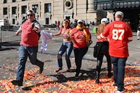 People flee after shots were fired near the Kansas City Chiefs' Super Bowl LVIII victory parade on February 14, 2024, in Kansas City, Missouri. (Photo by Andrew CABALLERO-REYNOLDS / AFP) (Photo by ANDREW CABALLERO-REYNOLDS/AFP via Getty Images)