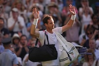 Britain's Andy Murray leaves the court after losing to Stefanos Tsitsipas of Greece in a men's singles match on day five of the Wimbledon tennis championships in London, Friday, July 7, 2023. (AP Photo/Alberto Pezzali)