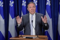 Quebec's police watchdog is investigating after a member of a provincial police tactical team shot a man suspected of making threats toward Premier François Legault and Prime Minster Justin Trudeau. Legault gestures as he speaks to the media on Wednesday, August 23, 2023, at the legislature in Quebec City. THE CANADIAN PRESS/Francis Vachon
