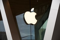 FILE - An Apple logo adorns the facade of the downtown Brooklyn Apple store in New York, Saturday, March 14, 2020. European Union regulators said they want to question Apple over accusations that it blocked video game company Epic Games from setting up its own app store, in a possible violation of digital rules that took effect in the 27-nation bloc Thursday, March 7, 2024. (AP Photo/Kathy Willens, File)