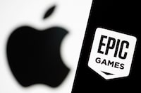 FILE PHOTO: Smartphone with Epic Games logo is seen in front of Apple logo in this illustration taken, May 2, 2021. REUTERS/Dado Ruvic/Illustration/File Photo