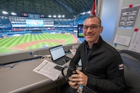 Toronto Blue Jays announcer Ben Wagner sits in the broadcast booth in Toronto, Sunday, April 10, 2022. Sportsnet, the Blue Jays' radio rightsholder, will not resume on-site radio broadcasts for the 2023 regular season and will instead use remote coverage from its downtown Toronto studio for road games. THE CANADIAN PRESS/Frank Gunn