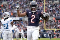 Chicago Bears wide receiver DJ Moore celebrates his touchdown reception from quarterback Justin Fields in the end zone during the second half of an NFL football game against the Detroit Lions Sunday, Dec. 10, 2023, in Chicago. (AP Photo/Nam Y. Huh)