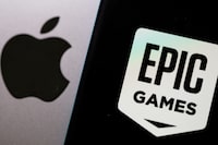 FILE PHOTO: Smartphone with Epic Games logo is seen in front of Apple logo in this illustration taken, May 2, 2021. REUTERS/Dado Ruvic/Illustration/File Photo